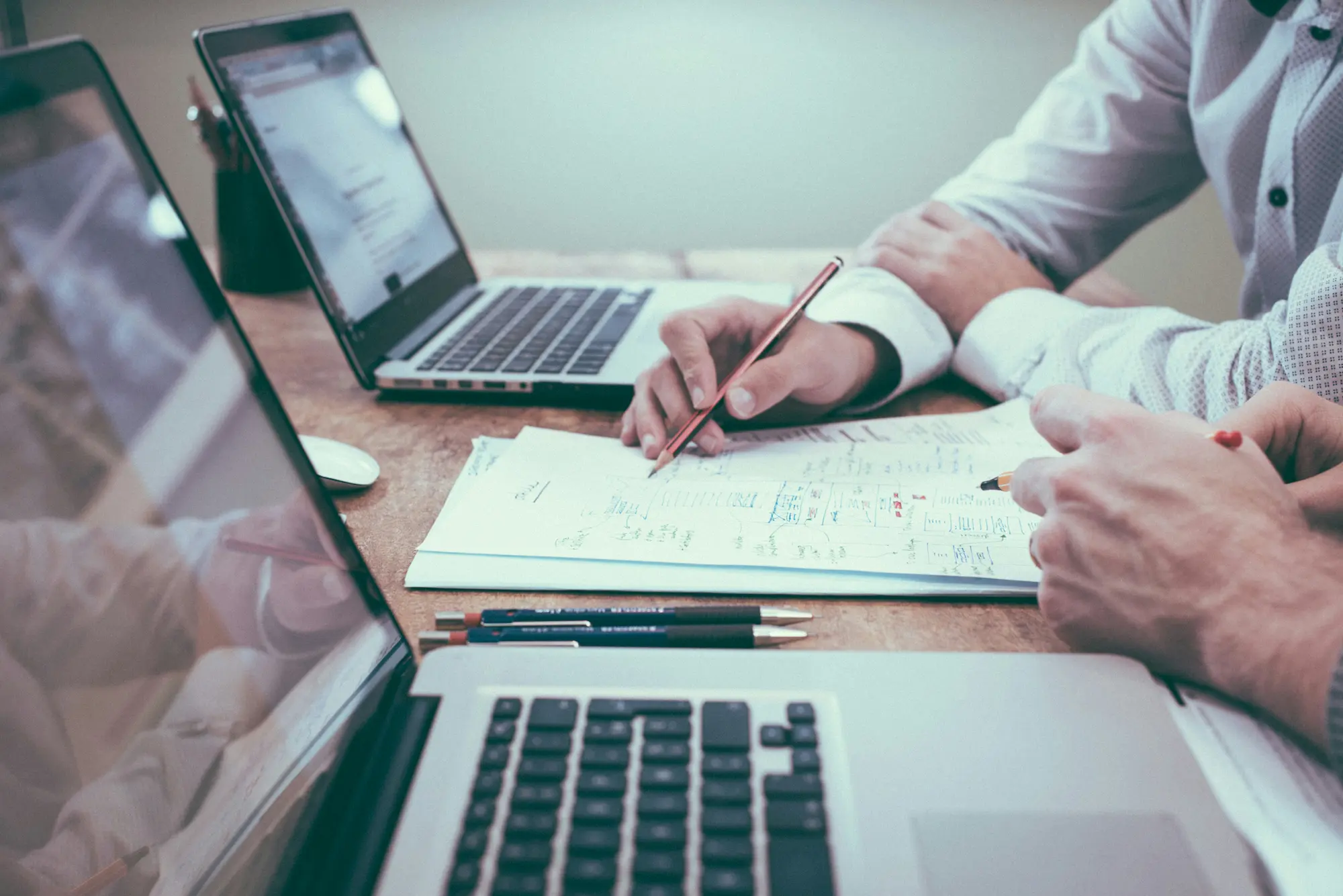 ERP for mining equipment with laptops and reports in use, image by Novacura