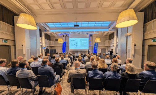 Photo from Novacura Flow User Conference 2025 featuring the conference room from the back during one of the presentations