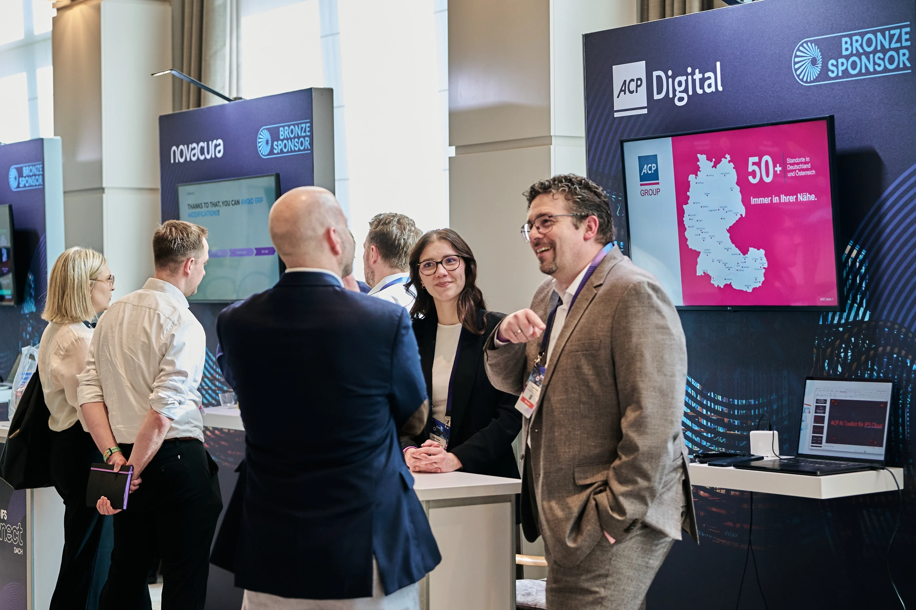 Attendees connecting and exchanging ideas on industrial AI and logistics advancements during WP – IFS Connect DACH 2026 in Munich, with discussions centered on new IFS innovations and the Softeon acquisition.