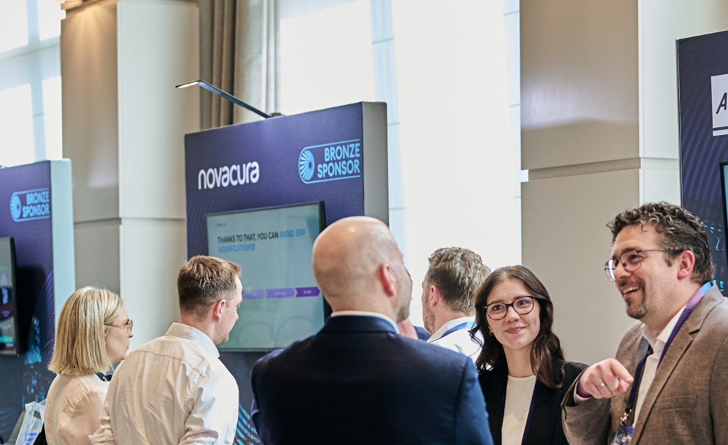 Attendees connecting and exchanging ideas on industrial AI and logistics advancements during WP – IFS Connect DACH 2026 in Munich, with discussions centered on new IFS innovations and the Softeon acquisition.