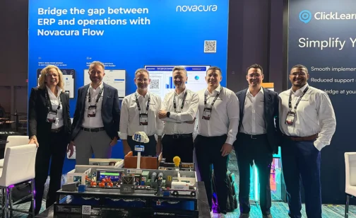 The Novacura team at the company’s IFS Unleashed 2026 booth, standing in front of a banner reading “Bridge the gap between ERP and operations with Novacura Flow”, with a Novacura Flow demo model on the table in front of them.
